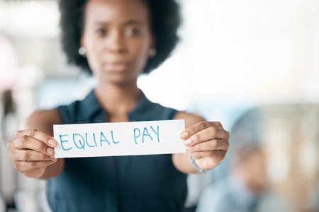 Paper sign, gender and finance equality with black woman, salary and pay gap. Equity, balance and opinion for fair opportunity, human rights bias and social transformation with business employeeの写真素材