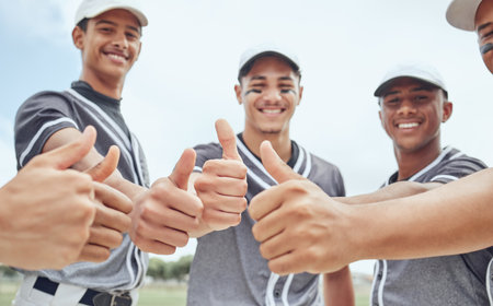 Men, baseball team or thumbs up hands in success, support or motivation in baseball game, match or competition training. Portrait, smile or happy baseball players and winner gesture in fitness sportsの写真素材