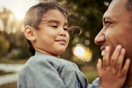 Happy, father and girl face with smile for family quality bonding time together in the outdoors. Love of dad and kid happiness, smiling and joyful for carefree summer vacation in nature forestの写真素材