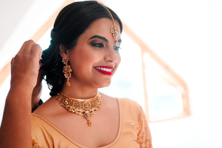 Bridal makeup done right. a beautiful young woman getting ready for her wedding.