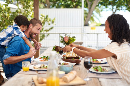 Always make time for family. a beautiful young family enjoying themselves while having a meal...
