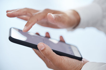 Businessman hands working with phone screen with in a office online on a mobile. Digital, internet...