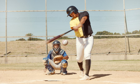Sports man, field and baseball player strike ball in game competition, practice or bat training...