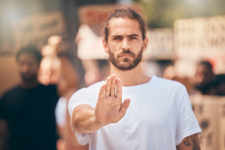 Stop, protest and gen z man hand with people in street for freedom or human rights. Justice,...