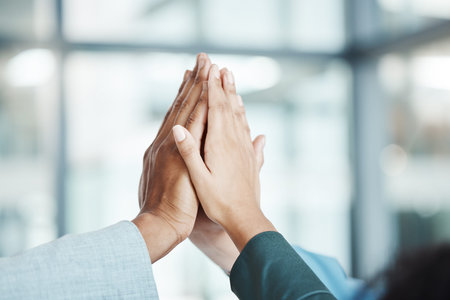 Hands, high five and motivation with a team working in collaboration together in the office. Team...