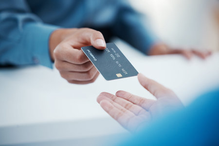 Corporate hands exchange credit card to accountant for payment for company tax bills, money loan and...