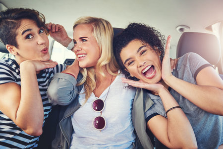 Were off on another road trip. girlfriends out on a road trip together.の写真素材