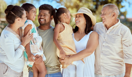 Nature, love and big family on summer vacation holiday outdoors bonding, relaxing and having fun in...