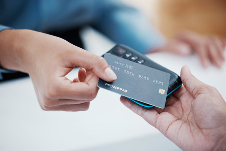 Credit card, payment and nfc with the hand of a customer scanning a chip for a purchase in a retail store. Finance, money and fintech with a consumer paying using wireless technology for shoppingの写真素材