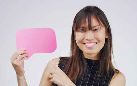 That right there proves my point. Portrait of an attractive young woman holding a speech bubble...