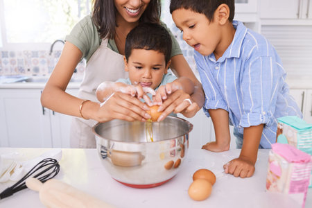Baking, mother and children learning about cooking, food and lunch in the kitchen together. Happy,...