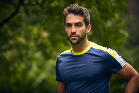 I hope you know how important exercise is. Portrait of a sporty middle-aged man standing with his hands on his hips.の写真素材