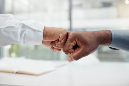 Hands, motivation and collaboration fist bump hand gesture, sign or icon with teamwork, support and collaboration. Diversity worker group or business people together in unity, solidarity and welcomeの写真素材