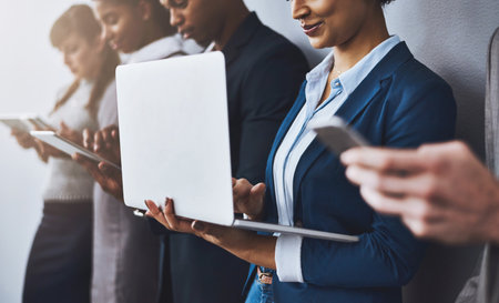 Theyre the best of the best. a group of young businesspeople waiting in line for their interviews.の写真素材