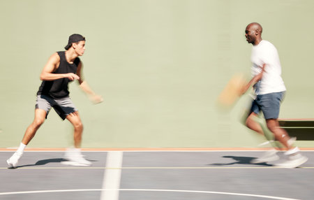 Basketball, team and blur motion for training on court, playing or have fun for game day in summer. Sports, players or practice for match, wellness or health for collaboration, tournament and outdoorの写真素材