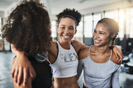 Friends make getting fit even more fun. a group of happy young women enjoying their time together at the gym.の写真素材