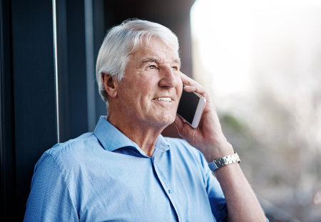 Treat every client like they your only client. a senior businessman on a call outside the office.の写真素材