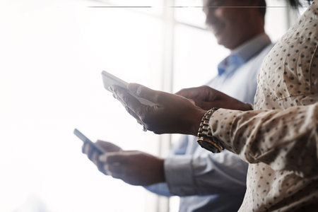 Connectivity gets you places. Closeup shot of two unrecognisable businesspeople using digital...
