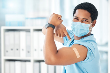 Man, covid face mask or muscle flex in hospital, clinic or pharmacy with vaccine plaster, bacteria...