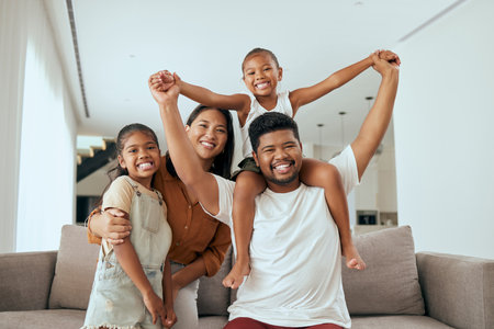 Black family, fun and parent hug with children in a family home with happiness and love. Portrait of happy kids, mother and dad playing in a new house with a parents smile in a living room loungeの写真素材