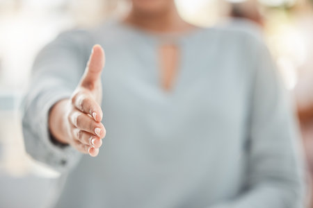 B2b, handshake and business woman offer hand in support of deal, partnership and collaboration on goal, vision and hiring. Hand shake, thank you and success at interview by leader for integrationの写真素材