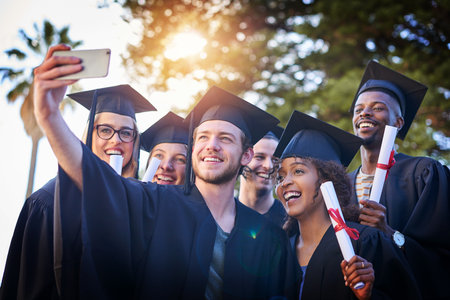 I want to frame this one. a group of university students taking a selfie on graduation day.の写真素材