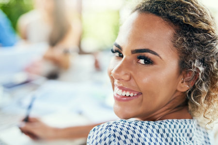 Im confident and ecstatic for the success we will see today. Portrait of a young businesswoman having a meeting with her colleagues outdoors.の写真素材
