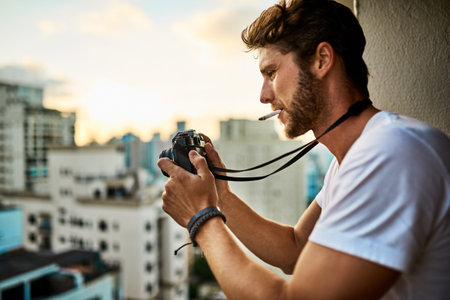 Photography is all about the angle. a young man taking photographs of the city with a camera...