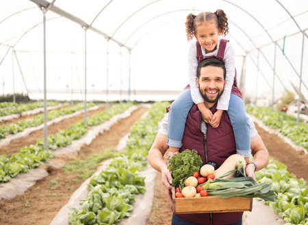 Greenhouse, father and girl with vegetables, happy or fresh produce from garden. Portrait, agriculture and parent with kid for organic food, harvest or sustainability farming for health and nutritionの写真素材