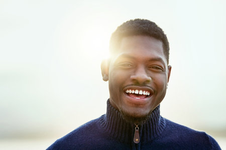 Welcome each day with a smile. Portrait of a handsome young man spending time outdoors.の写真素材