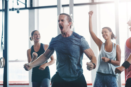 Hes a beast. a fitness group celebrating a victory at the gym.