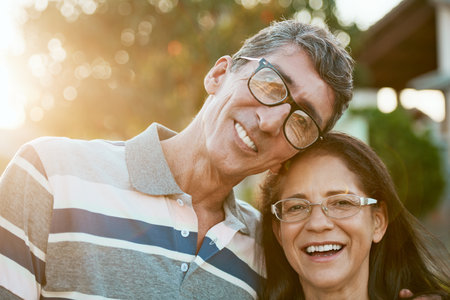 When you find your soulmate, marry them. Portrait of an affectionate mature couple standing together in their backyard.の写真素材