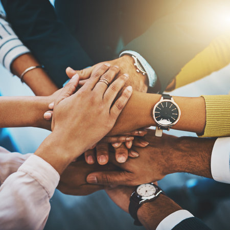 Only great things can be accomplished with teamwork. Closeup shot of an unrecognizable group of...