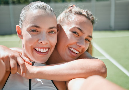 Tennis, friends and sport selfie of women with a smile ready for a sports exercise and match. Happy, fitness and training athlete people at outdoor game feeling healthy from workout on a tennis courtの写真素材