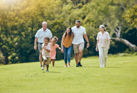 Grandparents, parents and children walking in park, happy and bonding outdoor, loving together and...