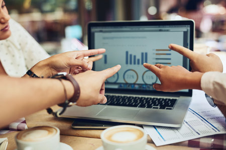 Stats are changing and they need to work on it. unrecognizable designers pointing at information on...