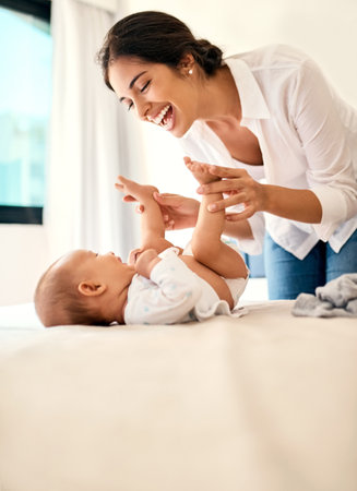 Mom love, you cant beat that bond. a happy mother bonding with her baby boy at home.の写真素材