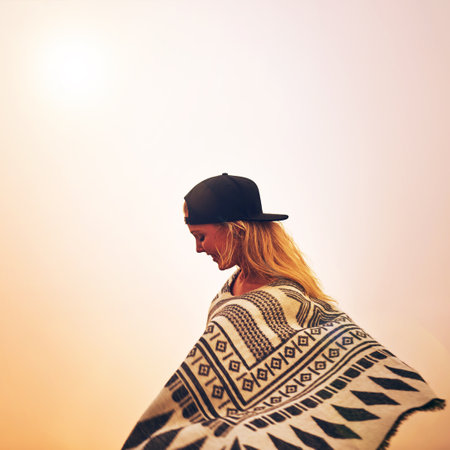 Rain or shine, shell be outside. a happy young woman admiring a foggy view from the top of a mountain.の写真素材