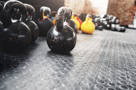 Muscles are sculpted with these. Still life shot of weights in a gym.の写真素材