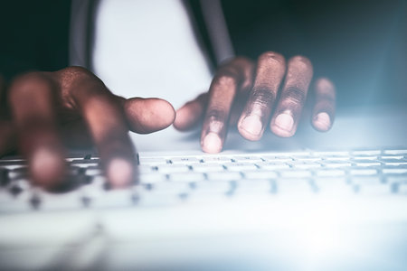 His fingers work fast. Closeup shot of an unrecognizable man typing on a keyboard while working late...