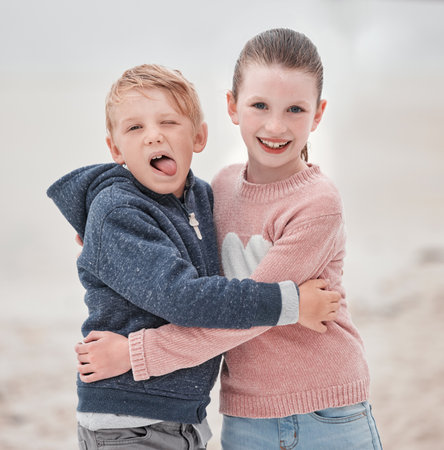 Smile, brother and sister with hug, happy and embrace being cheerful, fun and laugh together on summer break. Portrait, siblings or content being silly, goofy or outdoor for play, joyful or happinessの写真素材