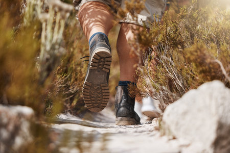 Hiking, shoes and man in a forest for fitness, exercise and workout in nature with morning cardio...
