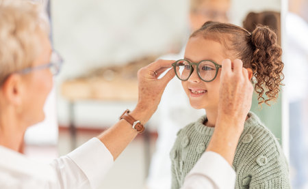Vision, eye care glasses and child with optometrist for ophthalmology consultation, help or support with eyesight. Healthcare service, optical check and expert consulting youth patient at eye examの写真素材