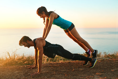 Sometimes you need that extra push...Full length shot of an attractive young woman on top of her...