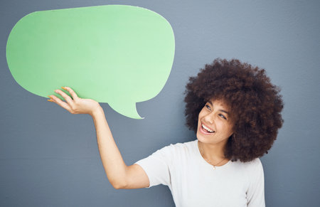 Happy black woman, speech bubble and studio background mockup space for advertising or product placement. Smile on face, information announcement for small business discount sale and excited woman.の写真素材