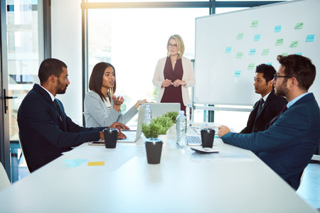 Together we will find a solution. corporate businesspeople having a meeting in the boardroom at work.の写真素材