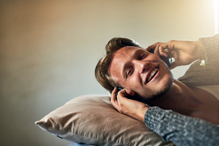 Some beats just speak to your soul. Portrait of a young man listening to music with headphones on at...