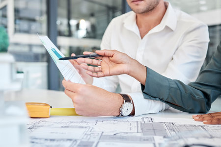Business people, architect hands and meeting in planning for floor plan, construction or design at...