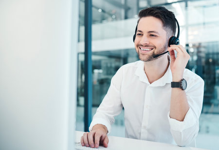 Telemarketing, customer service and call center worker with headset, happy and consulting online with computer. Consultant, customer support and contact us employee with advice, smile or help on crmの写真素材