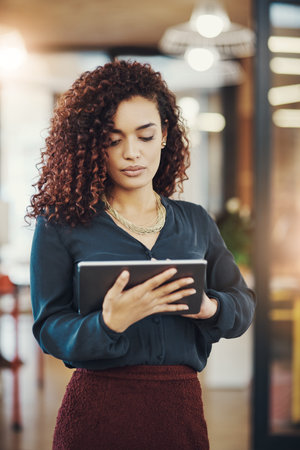 Internet searching is an essential research tool for businesses. a businesswoman using a digital...